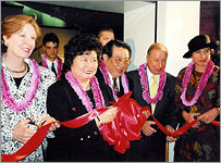  Yi-yu at a ribbon-cutting ceremony 
 at a Washington, D.C. art show 