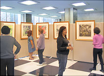  U.N. staff and exhibition volunteers enjoy a preview 